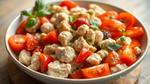 Mixing Chicken Salad with Fresh Tomatoes